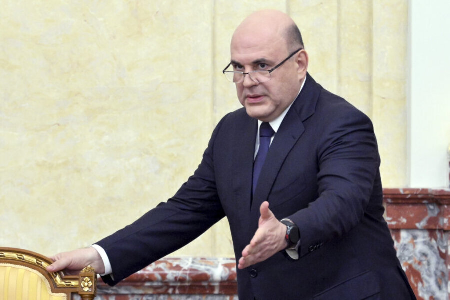 Russian Prime Minister Mikhail Mishustin gestures as he arrives to lead a cabinet meeting in Moscow, Russia, Thursday, July 11, 2024. (Alexander Astafyev, Sputnik, Government Pool Photo via AP)